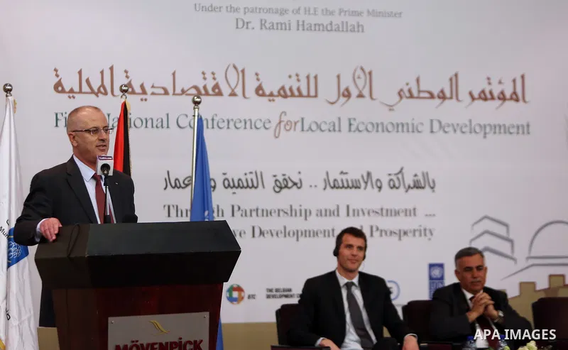 Palestinian Prime Minister Rami Hamdallah speaks during the First national conference for local economic development in the West Bank city of Ramallah on March 15, 2017. Photo by Prime Minister Office