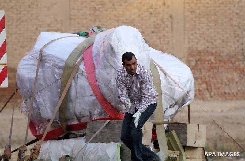 Egyptian workers use crane to lift the statue, recently discovered by a team of German-Egyptian archeologists before transport it to Egyptian museum in Cairo, Egypt on March 15, 2017. Statues of the kings and queens of t...