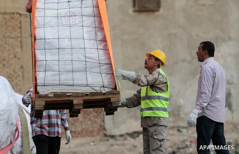 Egyptian workers use crane to lift the statue, recently discovered by a team of German-Egyptian archeologists before transport it to Egyptian museum in Cairo, Egypt on March 15, 2017. Statues of the kings and queens of t...