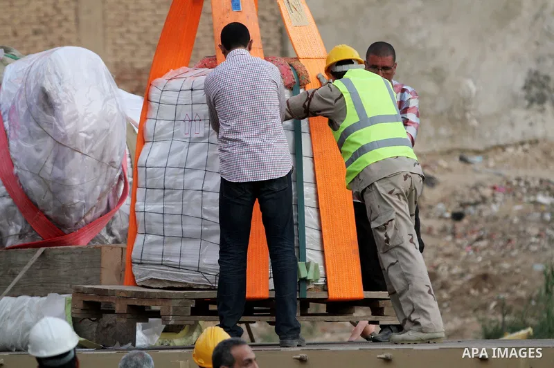 Egyptian workers use crane to lift the statue, recently discovered by a team of German-Egyptian archeologists before transport it to Egyptian museum in Cairo, Egypt on March 15, 2017. Statues of the kings and queens of t...