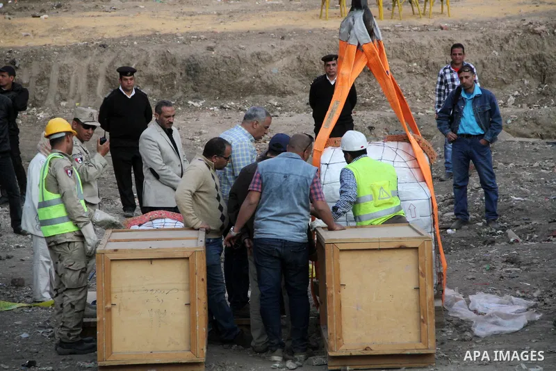 Egyptian workers use crane to lift the statue, recently discovered by a team of German-Egyptian archeologists before transport it to Egyptian museum in Cairo, Egypt on March 15, 2017. Statues of the kings and queens of t...