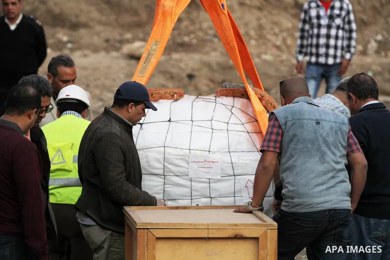 Egyptian workers use crane to lift the statue, recently discovered by a team of German-Egyptian archeologists before transport it to Egyptian museum in Cairo, Egypt on March 15, 2017. Statues of the kings and queens of t...