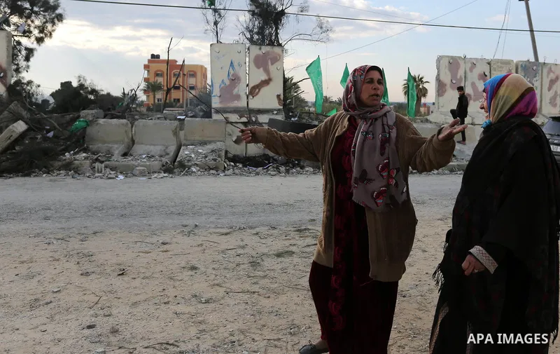Palestinians look at a Hamas site, which according to the Gaza police, was hit by an Israeli air strike, in Deir El-Balah, in the central Gaza Strip March 16, 2017. Photo by Ashraf Amra