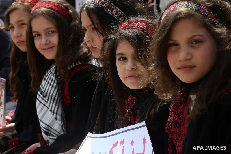 Palestinian children take part in a solidarity demonstration for Palestinian female prisoners in Israeli jails in front of International Red Cross office in Gaza City, Gaza on March 16, 2017. Photo by Ashraf Amra