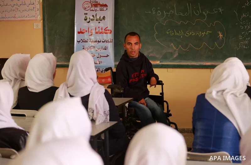 Disabled Palestinian, Mohammed abu Kmail, visits the schools, in Gaza city, on March 16, 2017, during an Initiative of the Disabled Union to introduce the disabled and how society deals with people with special needs. Ph...