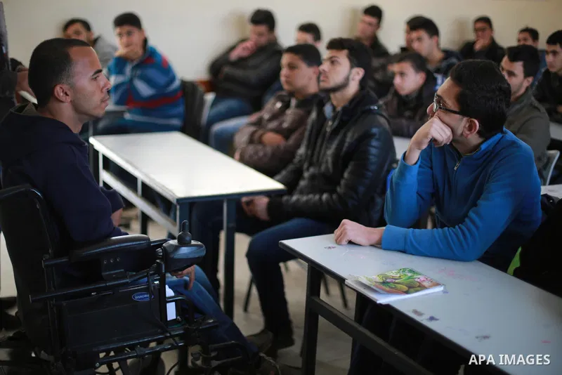 Disabled Palestinian, Mohammed abu Kmail, visits the schools, in Gaza city, on March 16, 2017, during an Initiative of the Disabled Union to introduce the disabled and how society deals with people with special needs. Ph...