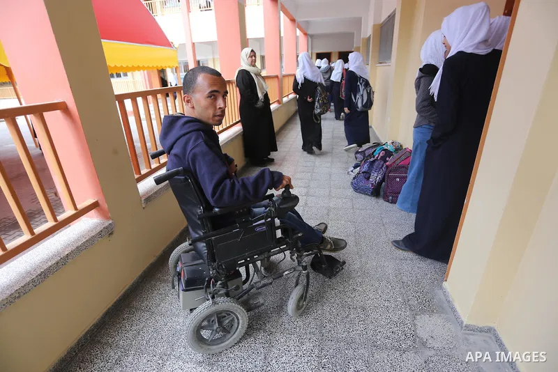 Disabled Palestinian, Mohammed abu Kmail, visits the schools, in Gaza city, on March 16, 2017, during an Initiative of the Disabled Union to introduce the disabled and how society deals with people with special needs. Ph...