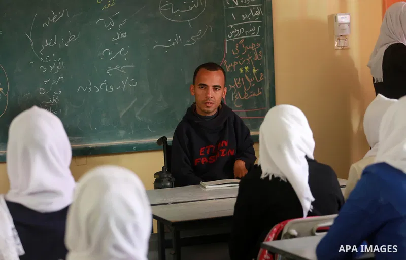 Disabled Palestinian, Mohammed abu Kmail, visits the schools, in Gaza city, on March 16, 2017, during an Initiative of the Disabled Union to introduce the disabled and how society deals with people with special needs. Ph...