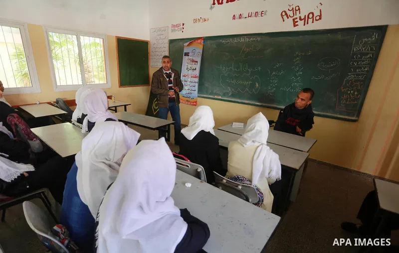 Disabled Palestinian, Mohammed abu Kmail, visits the schools, in Gaza city, on March 16, 2017, during an Initiative of the Disabled Union to introduce the disabled and how society deals with people with special needs. Ph...