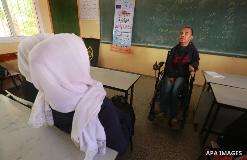 Disabled Palestinian, Mohammed abu Kmail, visits the schools, in Gaza city, on March 16, 2017, during an Initiative of the Disabled Union to introduce the disabled and how society deals with people with special needs. Ph...