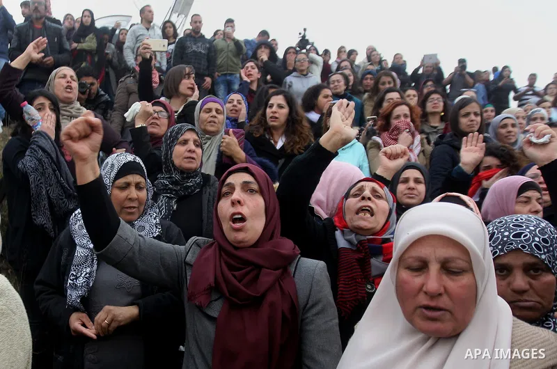 Palestinian women shout slogans during the funeral of Basel al-Araj, who was killed by Israeli forces during a clash, in the West Bank village of Walaja near Bethlehem, March 17, 2017. Photo by Wisam Hashlamoun