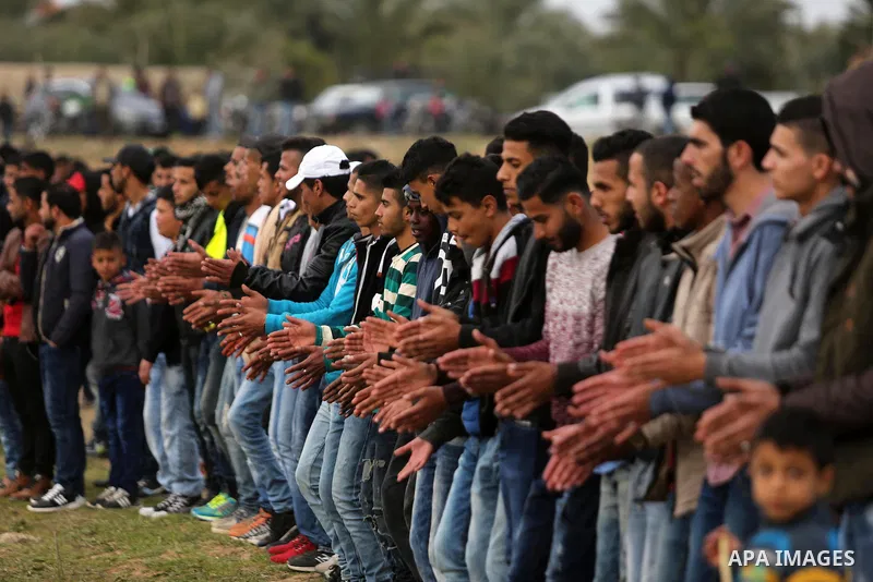 Palestinians perform the traditional dancing during a heritage festival in Zawayda in the central Gaza Strip March 17, 2017. Photo by Ashraf Amra