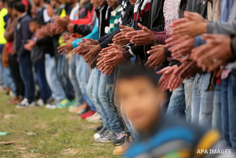 Palestinians perform the traditional dancing during a heritage festival in Zawayda in the central Gaza Strip March 17, 2017. Photo by Ashraf Amra