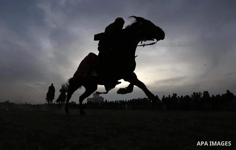 Palestinians ride horses during a heritage festival in Zawayda in the central Gaza Strip March 17, 2017. Photo by Ashraf Amra