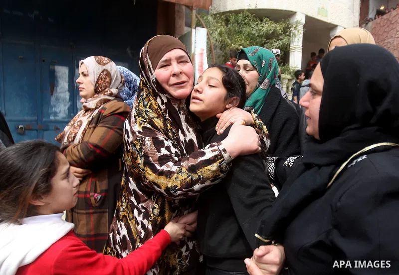Relatives of Palestinian youth Morad Abu Ghazi,16, who was killed by Israeli troops during clashes, mourn during his funeral in al-Arroub refugee camp near the West Bank city of Hebron March 18, 2017. Photo by Wisam Hash...
