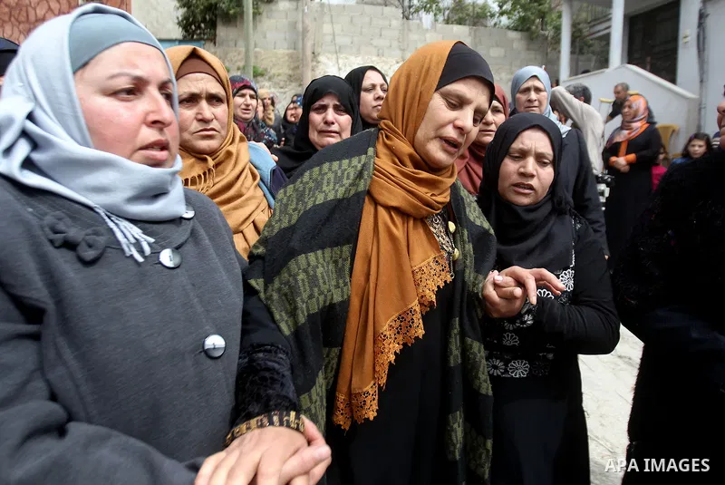 The mother of Palestinian youth Morad Abu Ghazi,16, who was killed by Israeli troops during clashes, mourns during his funeral in al-Arroub refugee camp near the West Bank city of Hebron March 18, 2017. Photo by Wisam Ha...