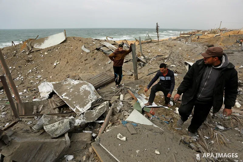 Palestinians inspect the scene of what Gaza police said was an Israeli air strike in Beit Lahia in the northern of Gaza Strip, on March 18, 2017. A rocket fired by Palestinians in the Gaza Strip slammed into southern Isr...