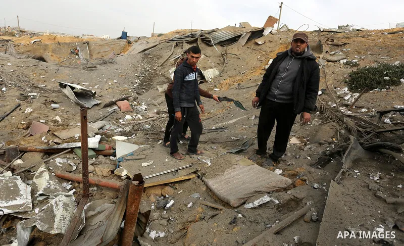 Palestinians inspect the scene of what Gaza police said was an Israeli air strike in Beit Lahia in the northern of Gaza Strip, on March 18, 2017. A rocket fired by Palestinians in the Gaza Strip slammed into southern Isr...