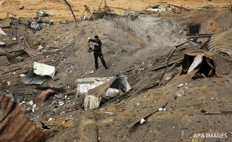 A Palestinian man inspects the scene of what Gaza police said was an Israeli air strike in Beit Lahia in the northern of Gaza Strip, on March 18, 2017. A rocket fired by Palestinians in the Gaza Strip slammed into southe...