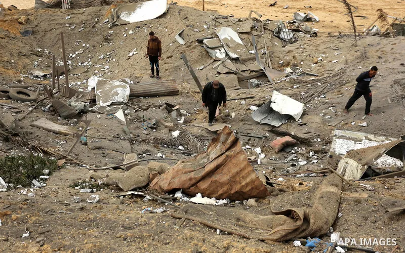 Palestinians inspect the scene of what Gaza police said was an Israeli air strike in Beit Lahia in the northern of Gaza Strip, on March 18, 2017. A rocket fired by Palestinians in the Gaza Strip slammed into southern Isr...