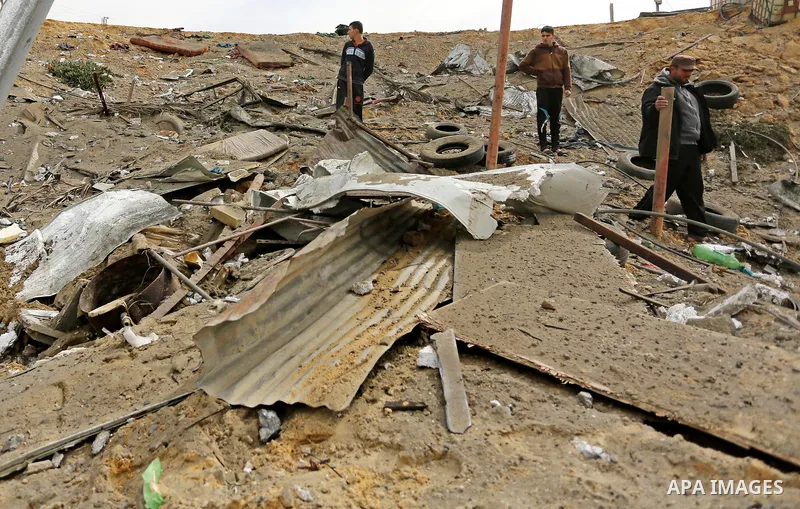Palestinians inspect the scene of what Gaza police said was an Israeli air strike in Beit Lahia in the northern of Gaza Strip, on March 18, 2017. A rocket fired by Palestinians in the Gaza Strip slammed into southern Isr...