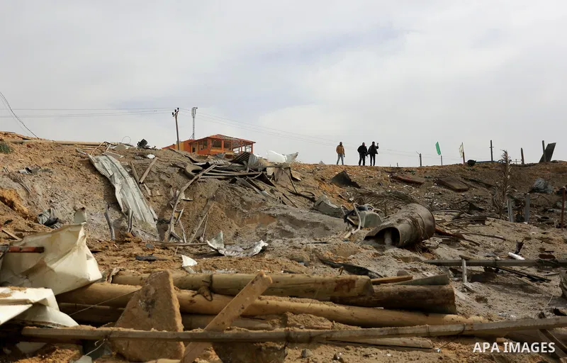 Palestinians inspect the scene of what Gaza police said was an Israeli air strike in Beit Lahia in the northern of Gaza Strip, on March 18, 2017. A rocket fired by Palestinians in the Gaza Strip slammed into southern Isr...