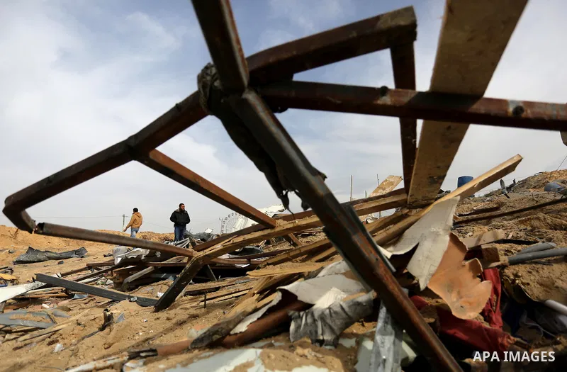Palestinians inspect the scene of what Gaza police said was an Israeli air strike in Beit Lahia in the northern of Gaza Strip, on March 18, 2017. A rocket fired by Palestinians in the Gaza Strip slammed into southern Isr...