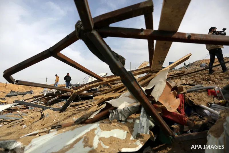 Palestinians inspect the scene of what Gaza police said was an Israeli air strike in Beit Lahia in the northern of Gaza Strip, on March 18, 2017. A rocket fired by Palestinians in the Gaza Strip slammed into southern Isr...