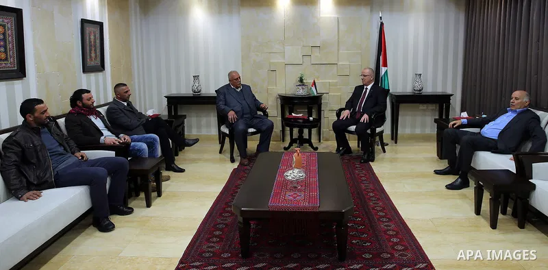 Palestinian Prime Minister Rami Hamdallah, meets with Prisoner Ibrahim masalma, in West Bank, city of ramallah on March19.2017. Photo by Prime Minister Office