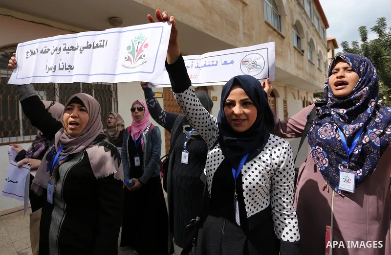 Palestinians hold banners during a protest demanding to prosecution anti-drug traders in Gaza City on March 19, 2017. Destroying the collected drugs was part of a new campaign by Hamas-run police to combat the usage of d...