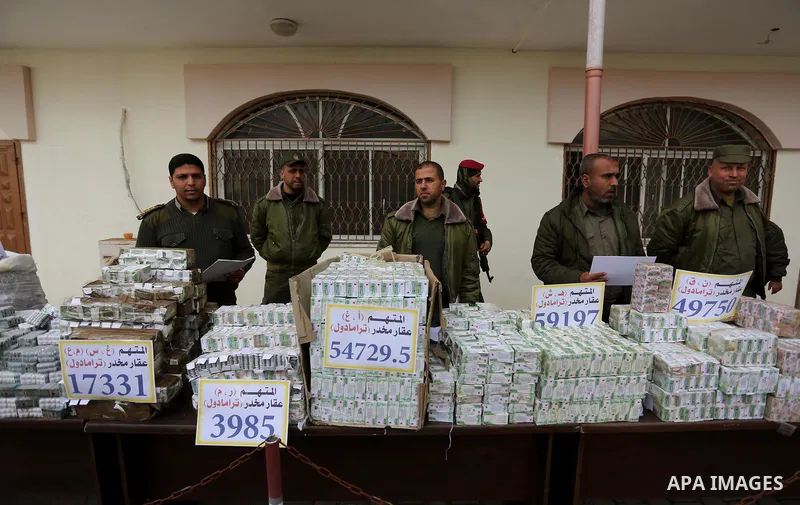 Palestinian anti-drug police participate in a conference drug damage in Gaza City on March 19, 2017. Destroying the collected drugs was part of a new campaign by Hamas-run police to combat the usage of drugs and Tramadol...