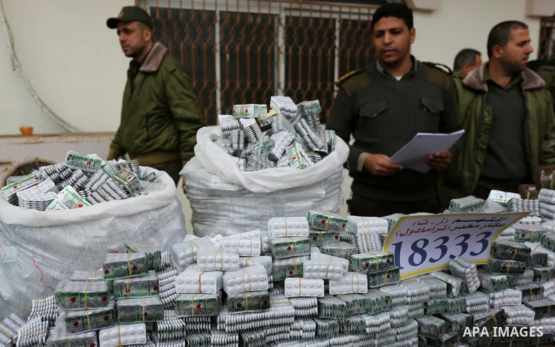 Palestinian anti-drug police participate in a conference drug damage in Gaza City on March 19, 2017. Destroying the collected drugs was part of a new campaign by Hamas-run police to combat the usage of drugs and Tramadol...