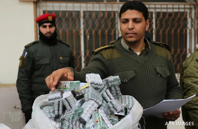 Palestinian anti-drug police participate in a conference drug damage in Gaza City on March 19, 2017. Destroying the collected drugs was part of a new campaign by Hamas-run police to combat the usage of drugs and Tramadol...