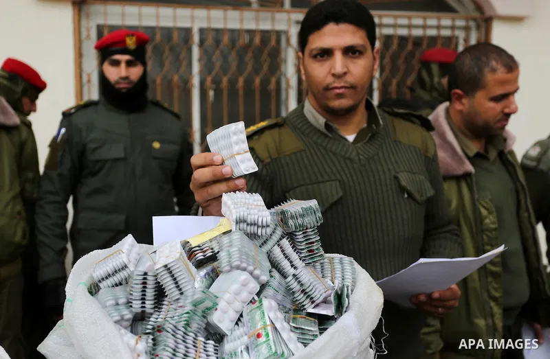Palestinian anti-drug police participate in a conference drug damage in Gaza City on March 19, 2017. Destroying the collected drugs was part of a new campaign by Hamas-run police to combat the usage of drugs and Tramadol...