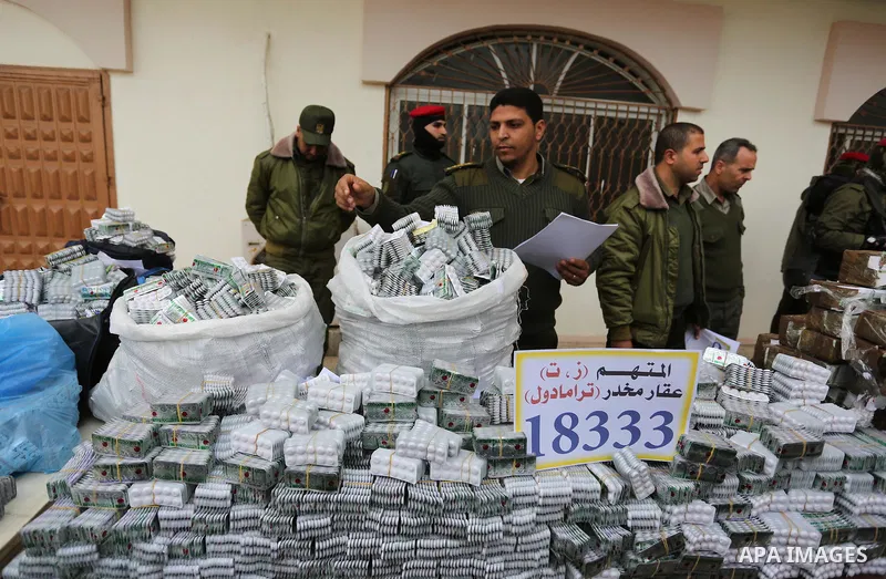 Palestinian anti-drug police participate in a conference drug damage in Gaza City on March 19, 2017. Destroying the collected drugs was part of a new campaign by Hamas-run police to combat the usage of drugs and Tramadol...
