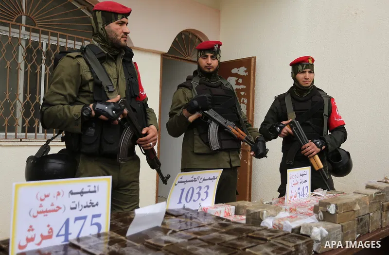 Palestinian anti-drug police participate in a conference drug damage in Gaza City on March 19, 2017. Destroying the collected drugs was part of a new campaign by Hamas-run police to combat the usage of drugs and Tramadol...