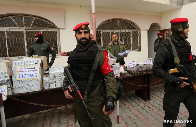 Palestinian anti-drug police participate in a conference drug damage in Gaza City on March 19, 2017. Destroying the collected drugs was part of a new campaign by Hamas-run police to combat the usage of drugs and Tramadol...