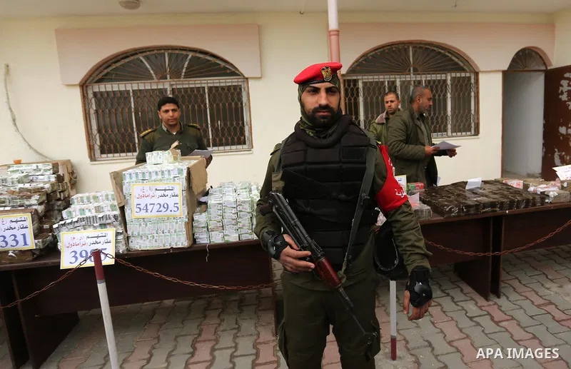 Palestinian anti-drug police participate in a conference drug damage in Gaza City on March 19, 2017. Destroying the collected drugs was part of a new campaign by Hamas-run police to combat the usage of drugs and Tramadol...
