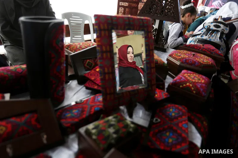 Palestinian women take part during Palestinian Heritage Exhibition on the theme ''Products of our women'', in Gaza City, on March 19, 2017. Photo by Ashraf Amra