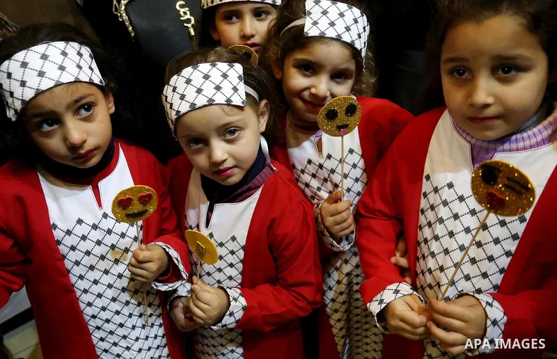 Palestinian women take part during Palestinian Heritage Exhibition on the theme ''Products of our women'', in Gaza City, on March 19, 2017. Photo by Ashraf Amra