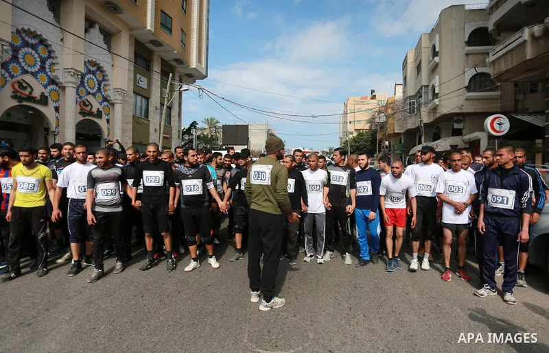 Palestinian youths take part in a marathon to show solidarity with Palestinian prisoners held in Israeli Jails, in front of Red cross office in Gaza city, on March 20, 2017. Photo by Mohammed Asad