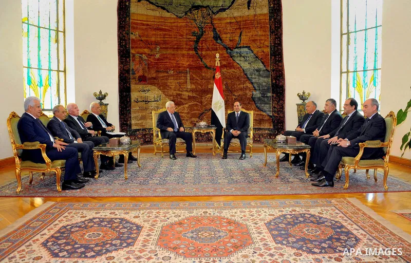 A handout picture released by the Egyptian Presidency on March 20, 2017 shows Egyptian President Abdel Fattah al-Sisi (R) meeting with Palestinian president Mahmud Abbas at the presidential palace in Cairo. Photo by Egyp...