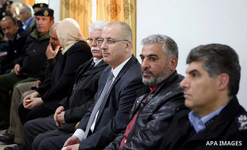 Palestinian Prime Minister Rami Hamdallah offers condolences to the family of Palestinian security officer Hasan Abu Alhaj who was killed during clashes in a raid to arrest a gunman, in the West Bank city of Ramallah on...