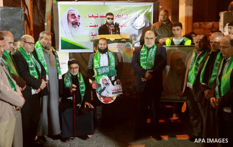 Palestinians take part in a memorial service marking the thirteenth anniversary of the death of late Hamas leader Sheikh Ahmed Yassin, who was killed in an Israeli attack in front of his house in Gaza City, March 21, 201...