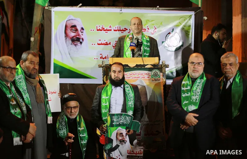 Palestinians take part in a memorial service marking the thirteenth anniversary of the death of late Hamas leader Sheikh Ahmed Yassin, who was killed in an Israeli attack in front of his house in Gaza City, March 21, 201...