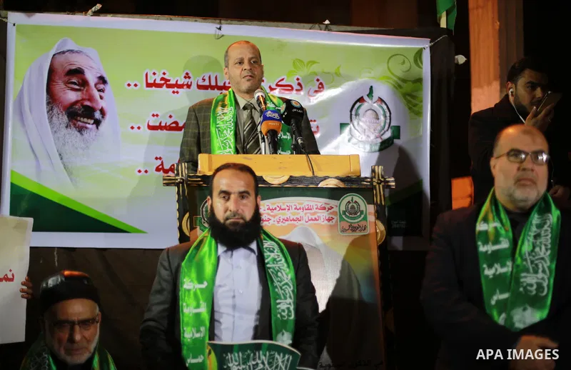 Palestinians take part in a memorial service marking the thirteenth anniversary of the death of late Hamas leader Sheikh Ahmed Yassin, who was killed in an Israeli attack in front of his house in Gaza City, March 21, 201...