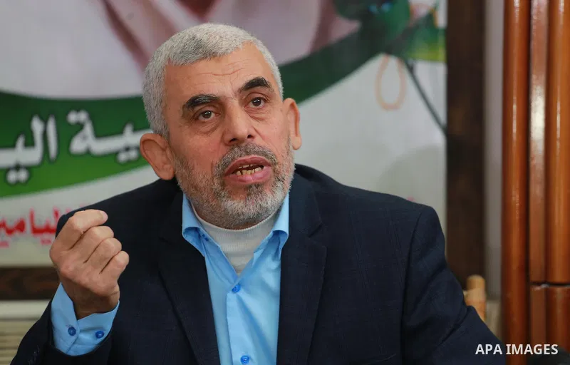 leader of Hamas in the Gaza Strip, Yahya Sinwar, speaks as he visits the family of late Hamas leader Sheikh Ahmed Yassin, who was killed in an Israeli attack marking the thirteenth anniversary of his death in Gaza City,...