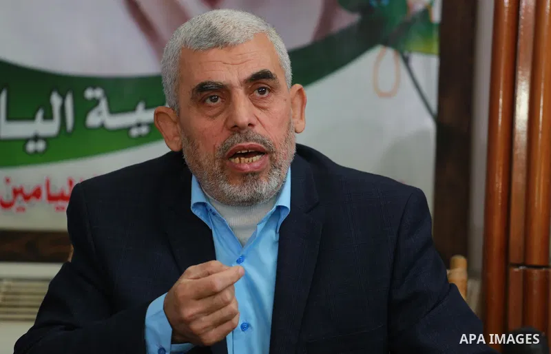 leader of Hamas in the Gaza Strip, Yahya Sinwar, speaks as he visits the family of late Hamas leader Sheikh Ahmed Yassin, who was killed in an Israeli attack marking the thirteenth anniversary of his death in Gaza City,...