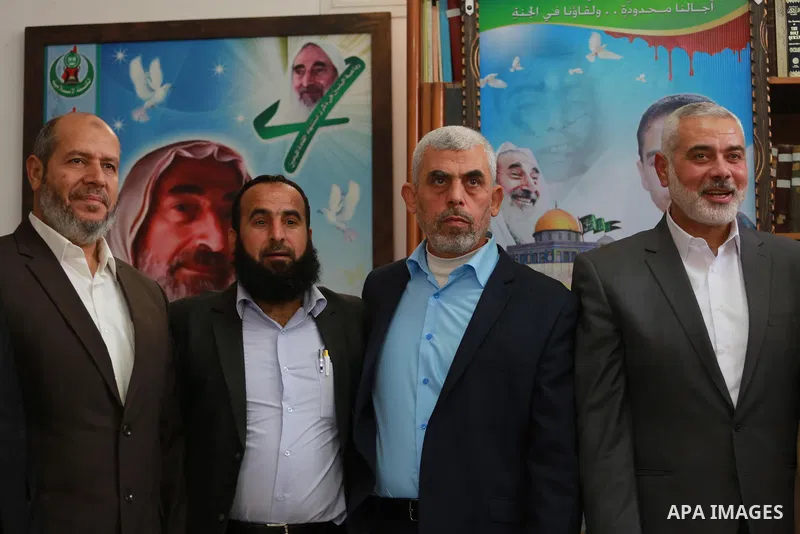 Senior Hamas leader Ismail Haniya, and leader of Hamas in the Gaza Strip, Yahya Sinwar, visit the family of late Hamas leader Sheikh Ahmed Yassin, who was killed in an Israeli attack marking the thirteenth anniversary of...
