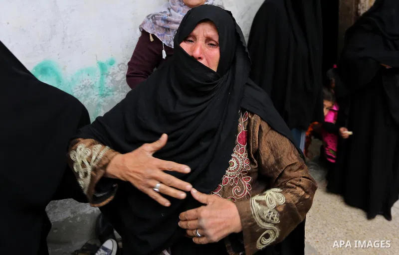 Relatives of Palestinian Youssef Abu Azra, who according to hospital officials was killed by Israeli fire and whom the Israeli forces said was detected with other suspects near the security fence, mourn during his funera...